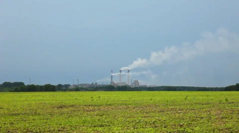 White smoke polluted sky over the green field Stock Footage 40624712