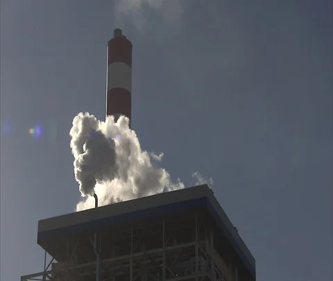 White smoke pouring out of chimney atop the Shenhua Sanhe power plant Stock Footage 86745893