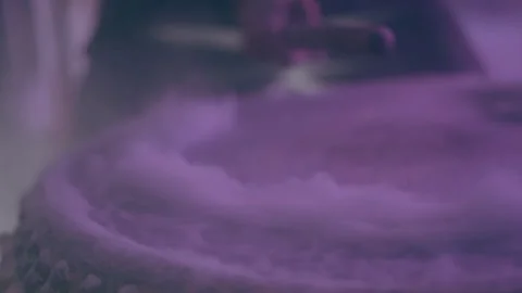 White smoke rising while a man is hitting the drum Stock Footage 279825853