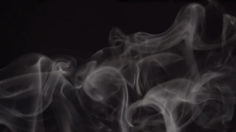 White smoke slowly floating and rolling through dark space. Видео 116898752