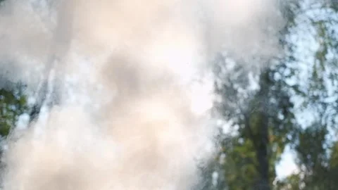 White smoke. Sun Light and Fog. Real fire smoke exploding outdoors against Stock Footage 324235362