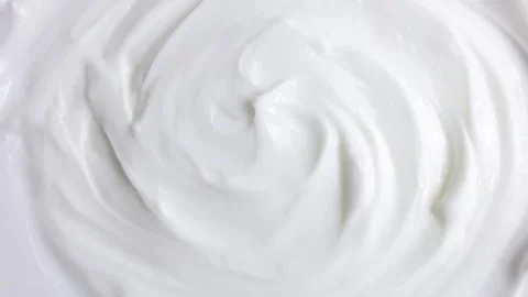 White smooth creamy moisturizing face cream texture rotation close up Stock Footage 236529361