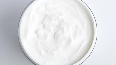 White smooth creamy moisturizing face cream texture, rotation close up. Top.. Stock Footage 259030974