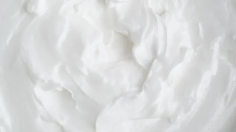 White smooth creamy moisturizing face cream texture, rotation, macro. Top vie Stock Footage 259031015