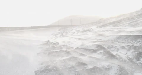 White snow blowing over rocks covered with ice and snow at the vulcano Stock Footage 149209041