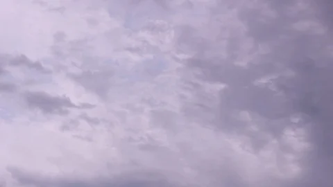 White snow clouds float under the sky Stock Footage 113897396