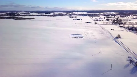 White Snow Covered Fields on Sunny Winter Day from Drone View with Power Lines Stock-Footage 151278291