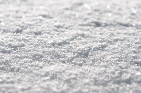 White snow surface close up and flakes background Stock Photos