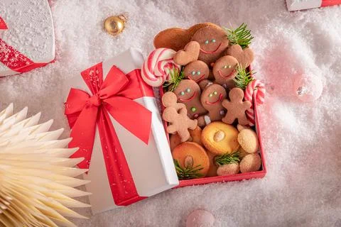 White snow table setting filled with festive baubles. Stock Photos