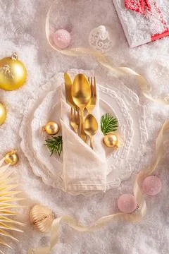 White snow table setting with snow trimmings. Stock Photos
