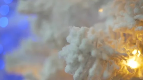 White snow tree is lit with multi-colored lights. Stock-Footage 143854031