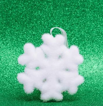 White snowflake on green background Stock Illustration