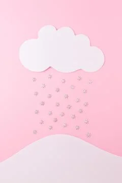 A white snowflake on a pink background. Stock Photos