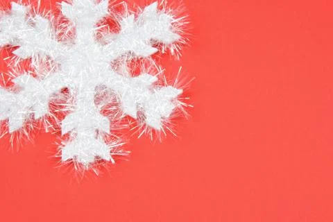 White snowflake on red background Stock Photos