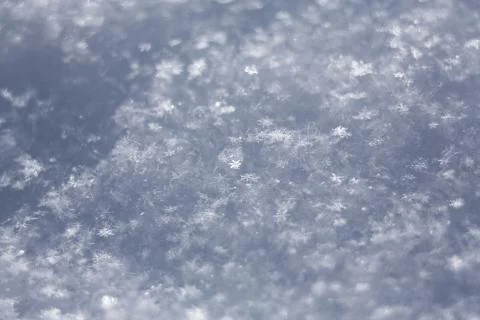 White snowflakes  background, rough pattern of snow texture Stock Photos