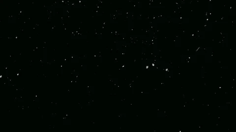 White snowflakes falling against a black background. Stock Footage 311376584