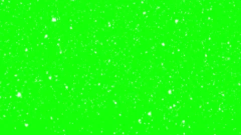 White snowflakes falling downward against vivid green screen background for Stock Footage 340942972