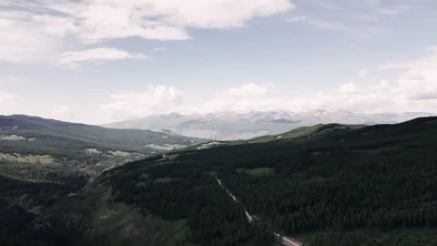 White snowy peaks of the mountain range under the clouds. The highest point of Stock Footage 166068807