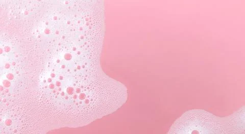 White soap foam bubbles on pink background, skincare cleansing and hygiene .. Stock Photos
