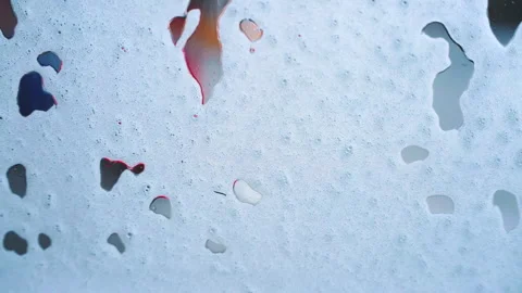 White Soap Foam on Car Window During Car Wash  Colorful Abstract Close-Up Video stock 331838616