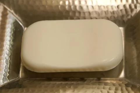White soap on a silver holder Stock Photos