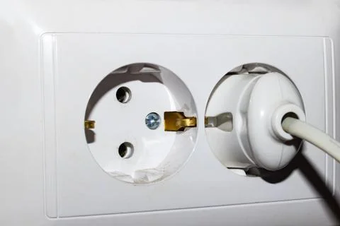 White socket and plug of electronic device Stock Photos