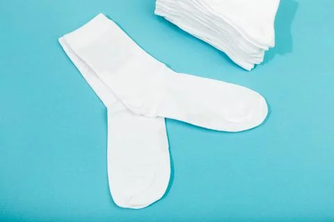 White socks on blue  background - Image Stock Photos