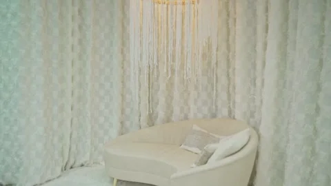White sofa with cushions under chandelier Stock Footage 273142012