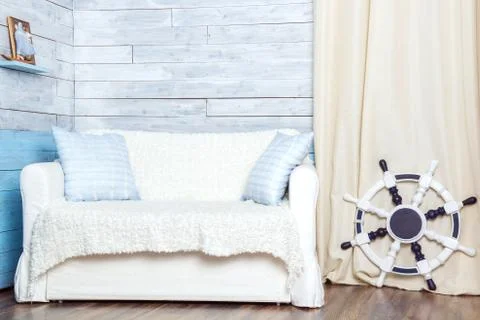 White sofa with a steering wheel Stock Photos