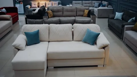 White sofa with two blue decorative pillows. Concept for a comfortable living Stock Footage 235056234