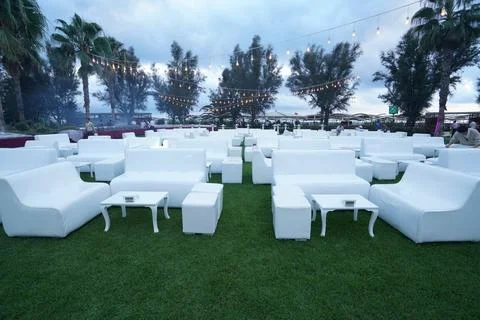 White sofas on green venue Stock Photos