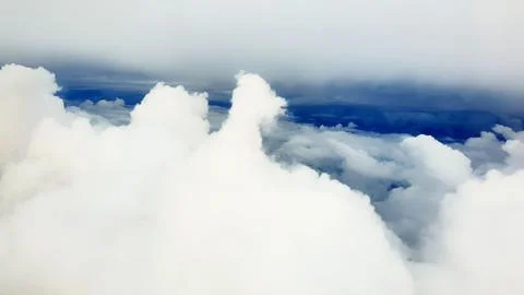 White soft clouds and blue sky in background 写真素材