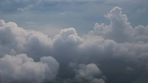 White soft fluffy clouds over the green landscape, aerial view from the plane. Stock Footage 112146249