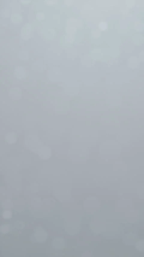 White soft snow particle stream with gently drifting glowing bokeh dots on .. Stock Footage 325115647