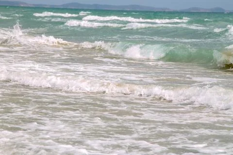 White soft wave on empty tropical beach and blue sea with blue sky Stock Photos