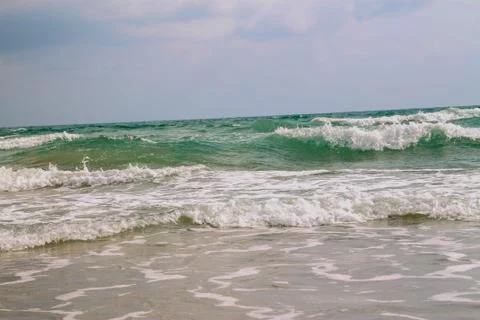 White soft wave on empty tropical beach and blue sea with blue sky Stock Photos