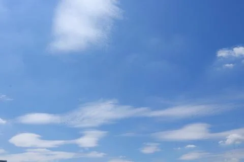 White softly clouds and blue sky. Stock Photos