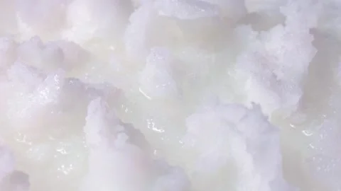 White solid coconut oil pieces circle rotation close up Stock Footage 260413298