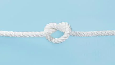 White solid rope with knot High resolution photo Stock Photos