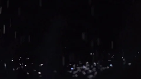 White sparkles falling on the black background, abstract slow motion Video stock 75965565