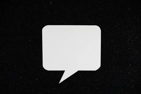 White Speech bubble mockup top view on black glitter background Stock Photos
