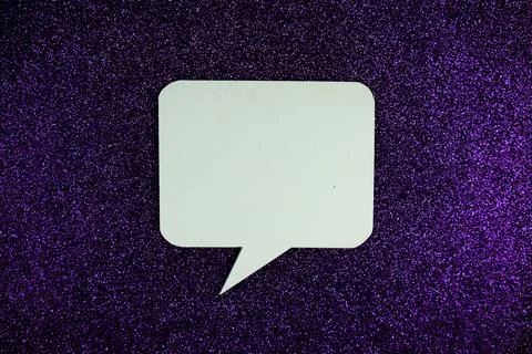 White Speech bubble mockup top view on purple glitter background Stock Photos