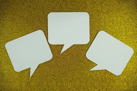 White Speech bubble mockup top view on yellow glitter background Stock Photos