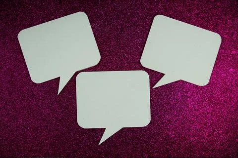 White Speech bubble mockup top view on pink glitter background Stock Photos