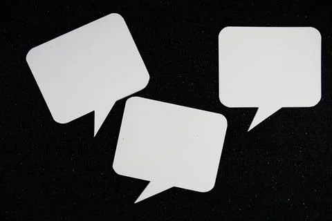 White Speech bubble mockup top view on black glitter background Stock Photos