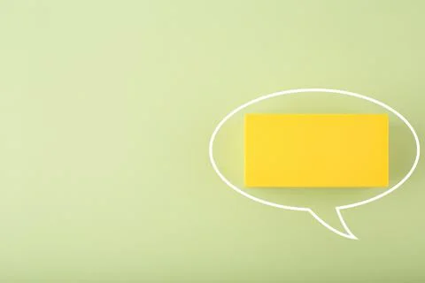 White speech bubble with space for text on bright green background with copy Stock Photos