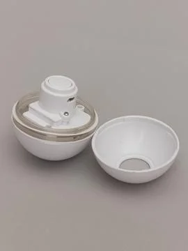 White spherical cat toy opened halves Stock Photos