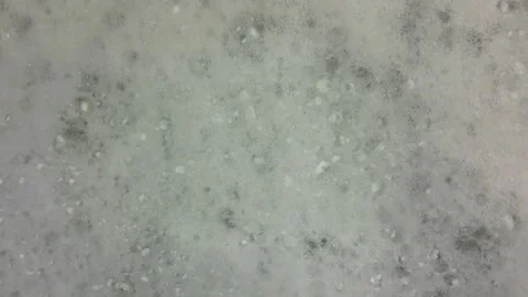 White spinning bath foam. Close-up of bath foam. Concept of cosmetics. Video stock 299864202
