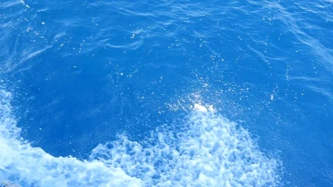 White Splashes on the Wavy Surface of Water Stock Footage 129955466