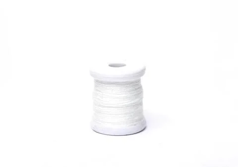 White spool of thread on a white background Foto stock